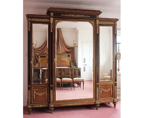 A fine French Louis XVI style ormolu mounted walnut and Coromandel wood nine piece bedroom suite in the manner of Henri Dasso