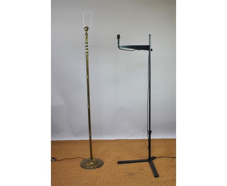 A flued brass standard lamp, with faceted glass upper section, on circular base, 151cm H, with a contemporary bronzed standar
