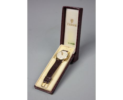 A 9ct gold 1950's gentleman's Tudor Rolex wristwatch, the circular face with an Arabic dial and a subsidiary second dial, wit