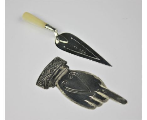 A novelty silver hand form bookmark, Cresford and Norris Birmingham 1904, 7cm long and a silver and mother of pearl trowel fo