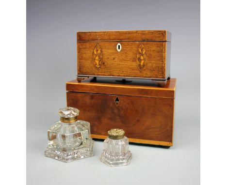An early 19th century inlaid mahogany tea caddy, 23cm. with a larger mahogany tea caddy, 28cm and two Victorian glass ink wel