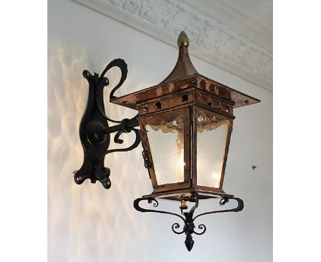 An Arts and Crafts copper, iron and brass lantern, possibly Birmingham Guild of Handicraft, the tapering copper lantern with 