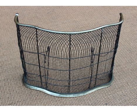 A George III brass and steel serpentine spark guard, 48cm H x 61cm W; with three steel fire tools and a copper coal scuttle (