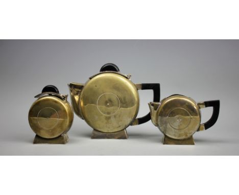 An Art Deco Bauhaus inspired silver plated three piece tea service, each piece of circular form and with ebonised handles and