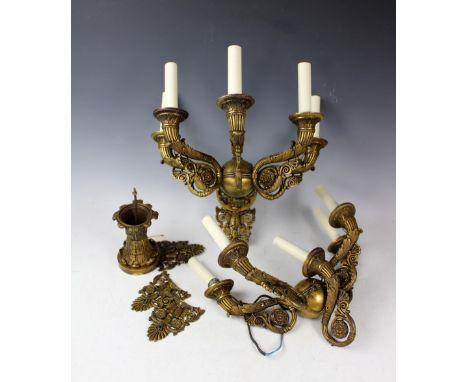 A pair of French Empire style gilt brass five branch wall lights, with acanthus leaf and anthemion cast scroll arms, with dou