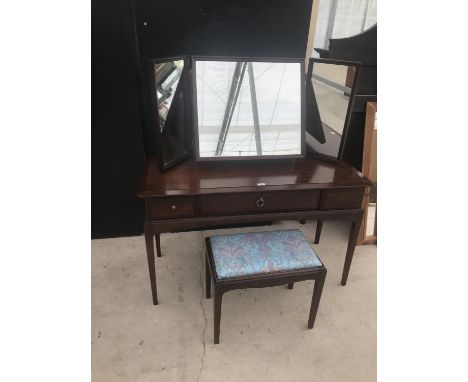 A STAG MINSTREL MAHOGANY DRESSING TABLE WITH THREE SECTION MIRROR AND DRESSING STOOL 