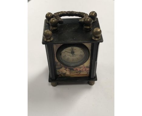 A MINIATURE CARRIAGE STYLE CLOCK WITH CONTINENTAL SCENE 