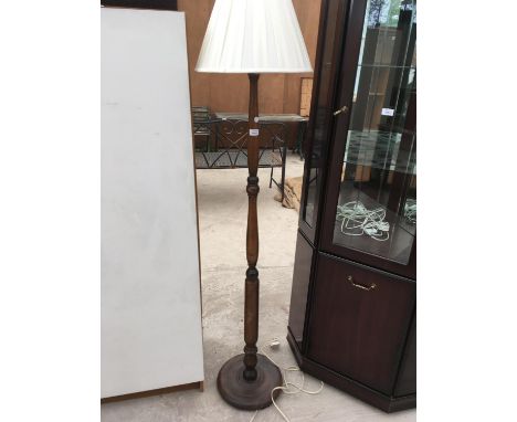 A TURNED MAHOGANY STANDARD LAMP 