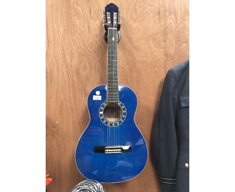 A BLUE ACOUSTIC GUITAR AND CASE 