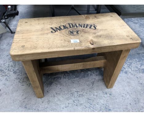 A WOODEN JACK DANIELS DESIGN STOOL 