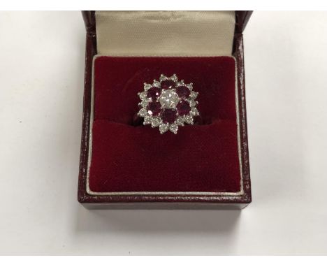 A LADIES RUBY AND DIAMOND CLUSTER RING, SET TO 18CT WHITE GOLD SHANK, WEIGHT 7G, CENTRAL DIAMOND APPROX 0.5CT, TOTAL DIAMONDS