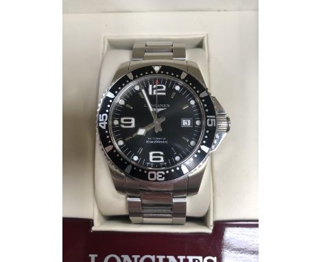 A GENTS BOXED LONGINES 'HYDROCONQUEST' AUTOMATIC DATE WATCH WITH ORIGINAL BOX AND INSTRUCTIONS MANUAL AND INTERNATIONAL WARRA