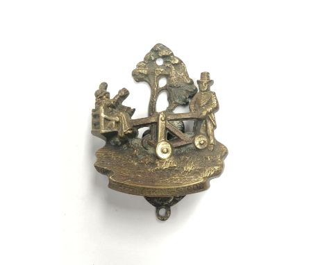 A BRASS 'THE DUCKING STOOL' DOOR KNOCKER 