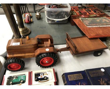 A WOODEN MODEL OF A TRACTOR AND TRAILER 