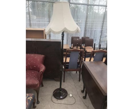 A MAHOGANY STANDARD LAMP 