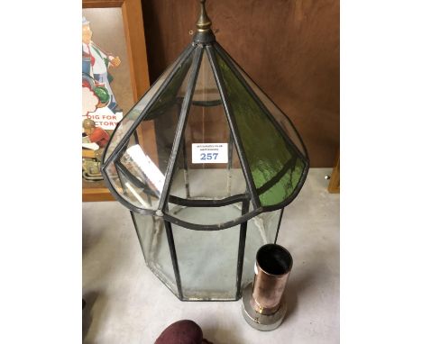 A DECORATIVE GARDEN LANTERN WITH GREEN GLASS PANELS WITH POKER STAND (2) 