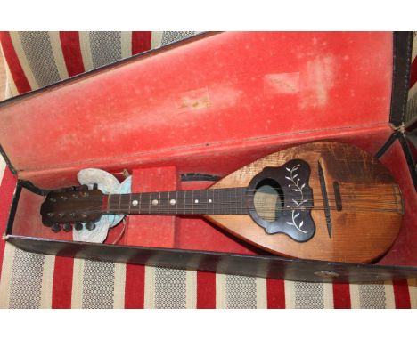 Vintage cased round back mandolin,