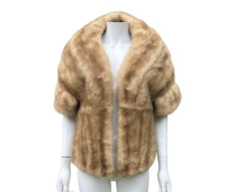 A C1950s palomino mink fur shrug with pockets set into the stranding of the mink pelts at the front. The back is set in horiz