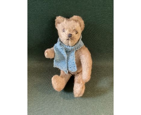 Miniature &nbsp;antique Teddy bear-Likely Farnell , with turned ears with a fully articulated body and a small knitted scarf