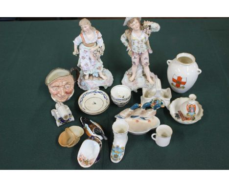 A pair of continental porcelain figures of gardeners c1900, a pair of English porcelain doll's teabowls and saucers c1800, a 