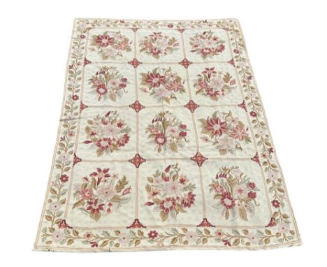 A large crewel work rug backed with cream canvas. The vendor purchased the rug from the estate of Sir Peter &amp; Lady Hilton