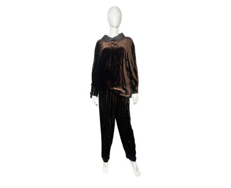 An early 1980s Gianni Versace trouser set in a rayon-cupro blend velvet. The trousers are high waisted with silk waist band a