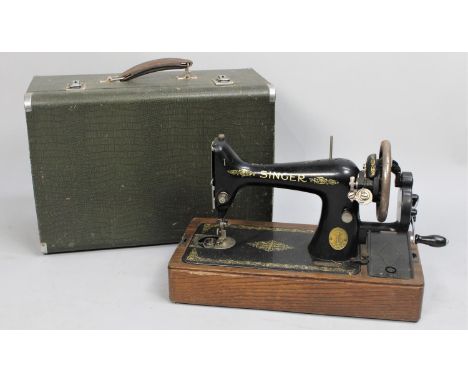 A Vintage Singer Manual Sewing Machine with carry case 
