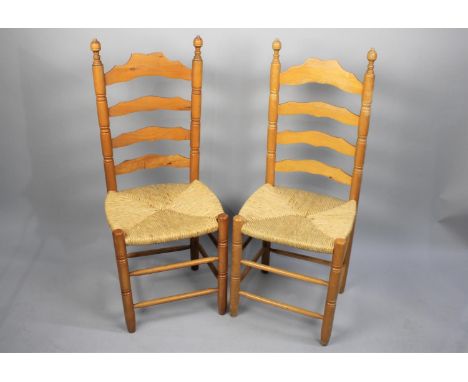 A Pair of Ladder Back Rush Seated Dining Chairs