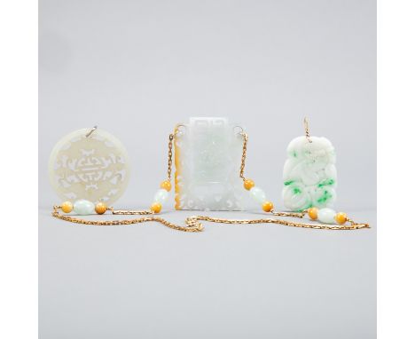Three Chinese 20th c. pierced jade pendants. One includes a chain and clasp, which are marked "585 Italy," indicating 14k gol