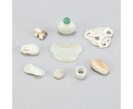 A grouping of Chinese Qing Dynasty pale jade celadon carvings including a lovely jade butterfly plaque, a well carved archers
