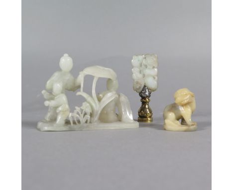 Group of three Chinese jade and soapstone carvings from the late 19th and early 20th c. Includes one soapstone foo dog, one j