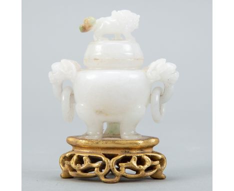 A very fine white jade tripod censer carved from white and green jade. The green of the jade is well integrated into the tail