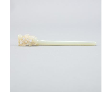 A 19th century Chinese pierced jade hairpin. The end of the pale celadon jade pin is delicately carved into the form of birds