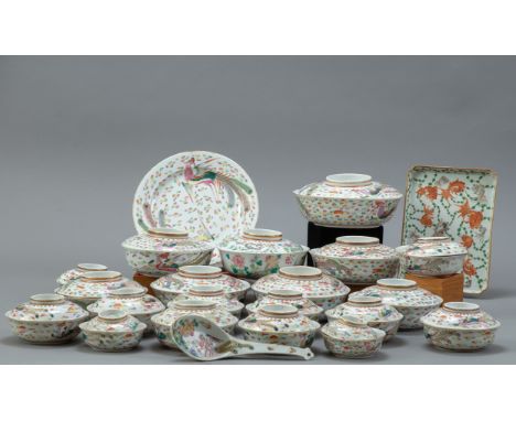 A Guangxu period Chinese dinner set. Lot includes four dinner plates, one serving tray, one serving spoon, and twenty bowls w