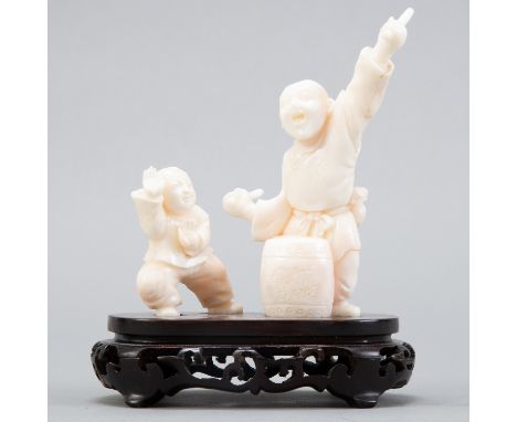 A lovely Chinese carving of two boys playing instruments together made of rare white coral. Excellent carving and craftsmansh