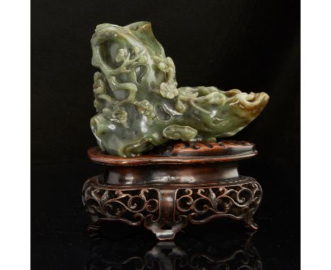 A lovely spinach jade carving of fine craftsmanship. A wonderful scholars object in very fine quality. A later rosewood stand