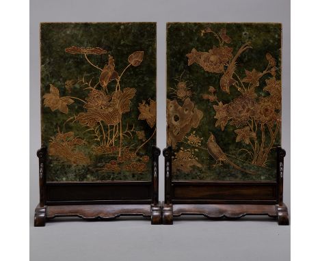A lovely pair of large Chinese spinach jade slabs which have been mounted into table screens and decorated with gold landscap