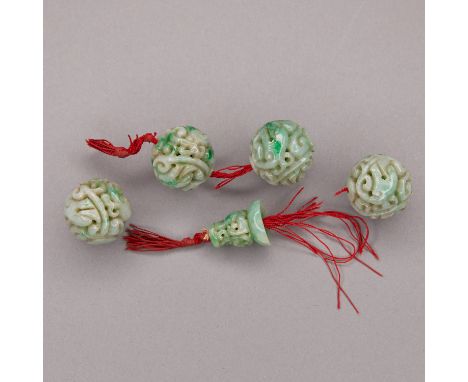 Set of five carved jade beads. Four are cylindrical and carved with a swirling dragon motif; excellent court-necklace beads. 