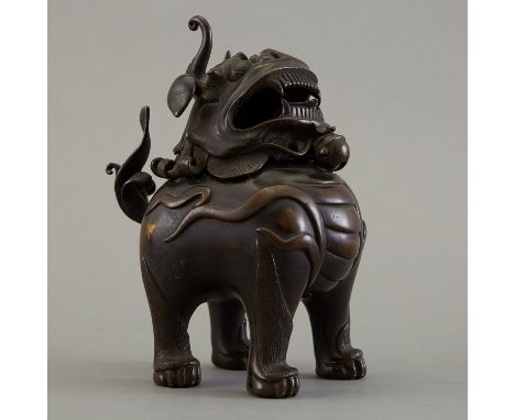A handsome late Qing Chinese Buddhist lion or shi shi censer that tilts open and is well cast. Late 19th or early 20th centur