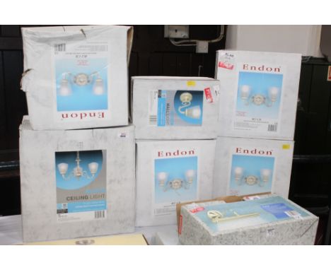 A three branch ceiling light fitting, four two branch wall light fittings and a single wall light fitting all matching cream 