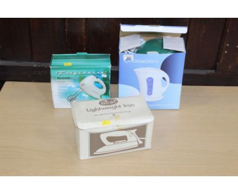 A light weight iron, cordless jug kettle and hand mixer