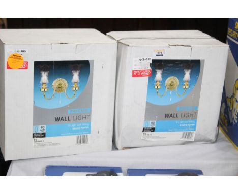 Two brass effect two branch wall light fittings, boxed, un-used 