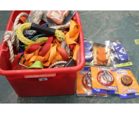 A tub of buckle tie backs, tow ropes, bungee cords, etc. 