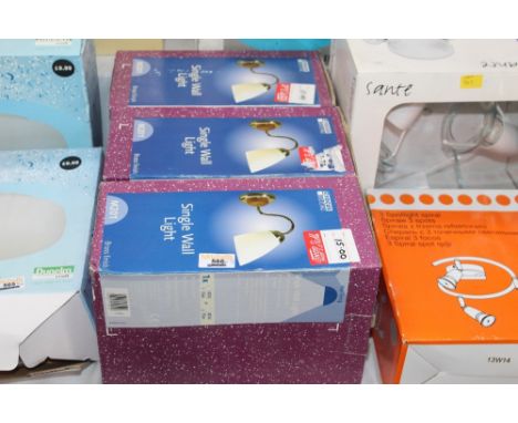Three matching boxed single wall light fittings