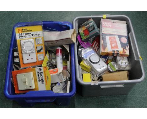 Two boxes of electrical fittings and assorted accessories, 24 hr plug in timer switch's, kettle element, fire blanket, infrar