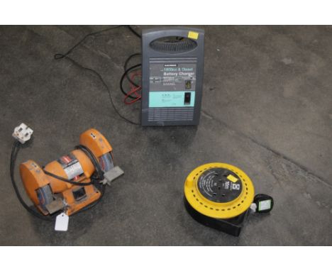 Small bench grinder, 10 meter extension reel and a battery charger 