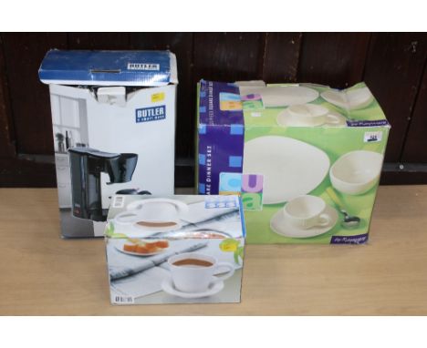 Butler coffee maker, 20 piece square dinner set and a set of six cups and saucers, boxed, un-used 