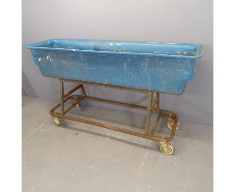A large rectangular plastic trough on wheeled metal base. 155x87x45cm.Depth of trough 30cm. 