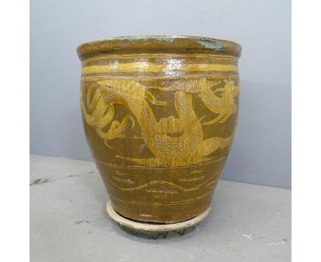 A large glazed ceramic plant pot, with Chinese dragon design and matching drip tray. 49x52cm. 