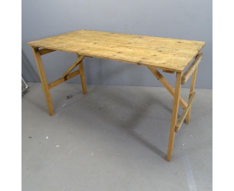A vintage pine folding plank top trestle table. 128x76x67cm. 